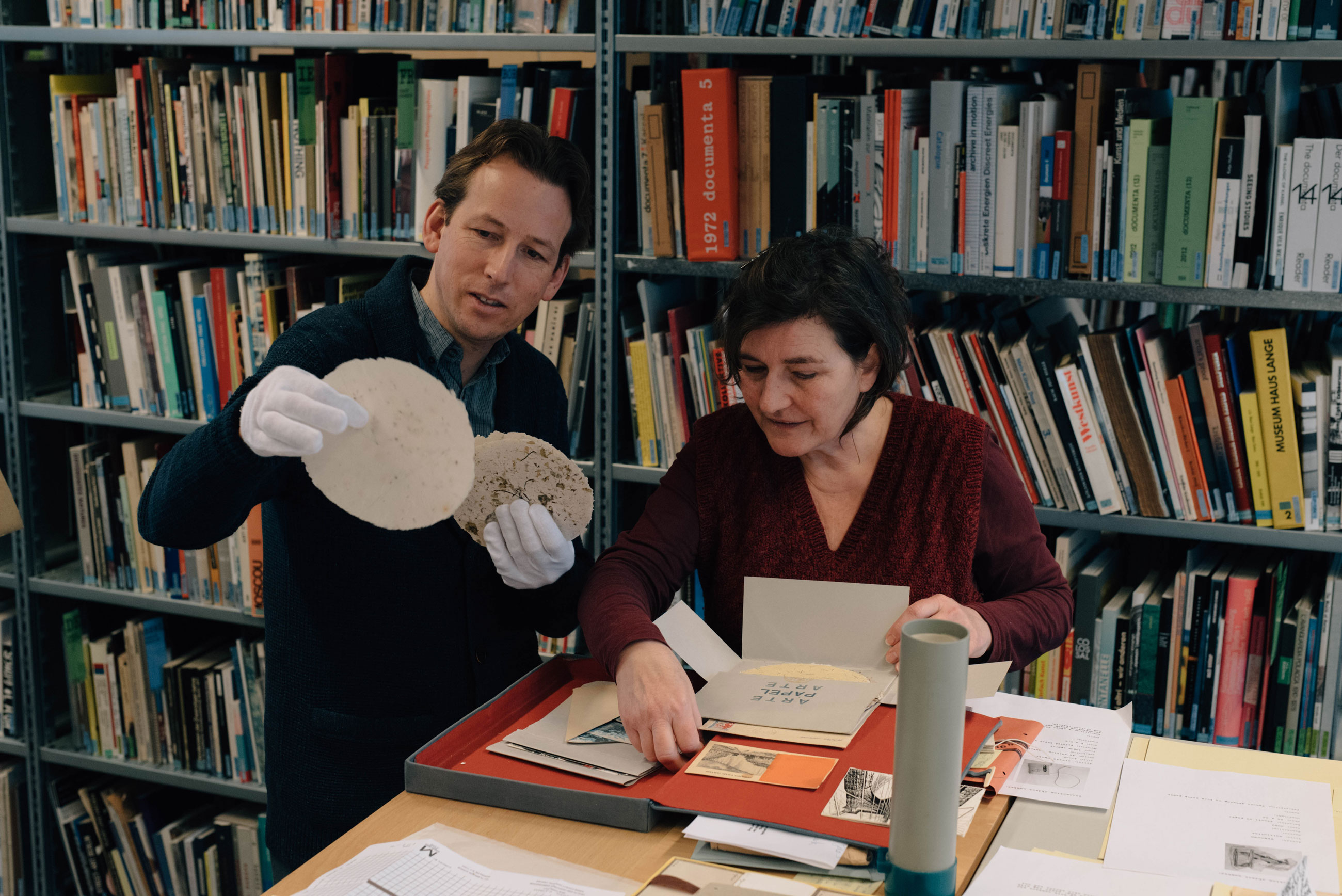 Archaeologist Miguel John Versluys and Nell Donkers at De Appel's Archive, part of the project Landscape with Bear, curated by the De Appel Curatorial Programme.