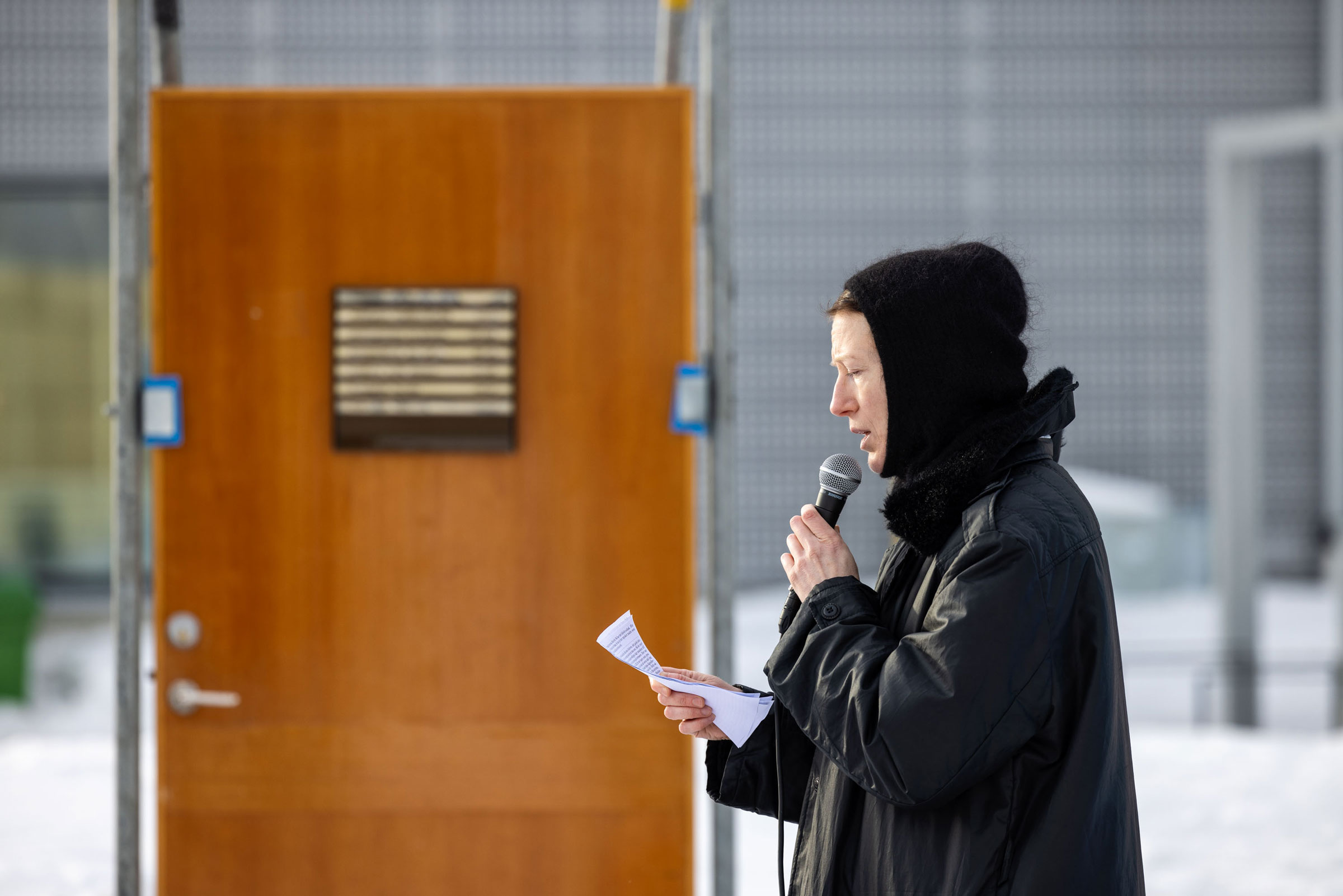 Artist Jenny Nordmark performing inside the installation with doors in Kiruna city center. Part of the Luleå Biennial curated by Bruno Alves de Almeida and Aude Christel