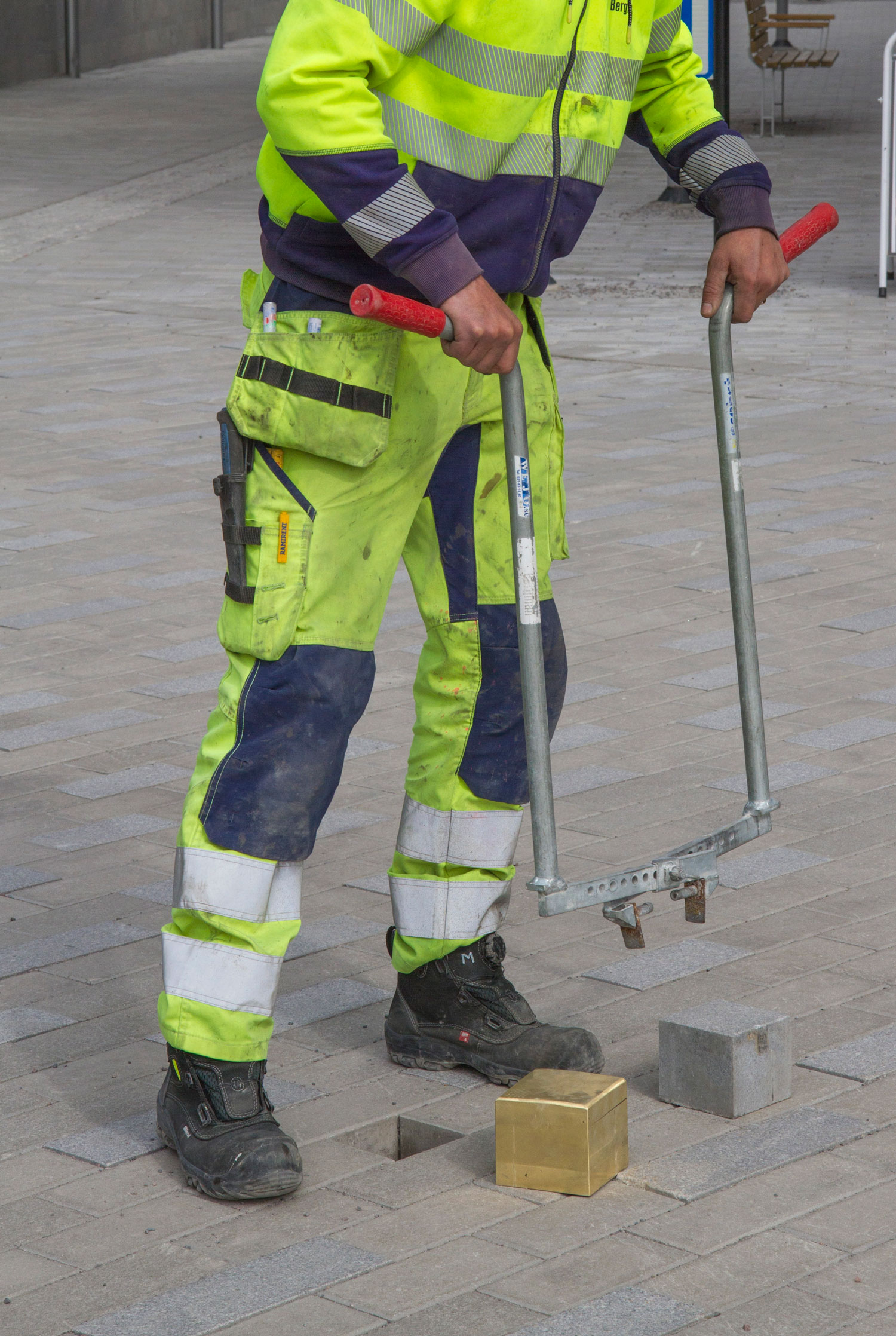 Pavement stone being substituted by a golden artwork in the city center of Kiruna in Sweden. A work by Daniel de Paula a part of the Luleå Biennial curated by Bruno Alves de Almeida and Aude Christel.