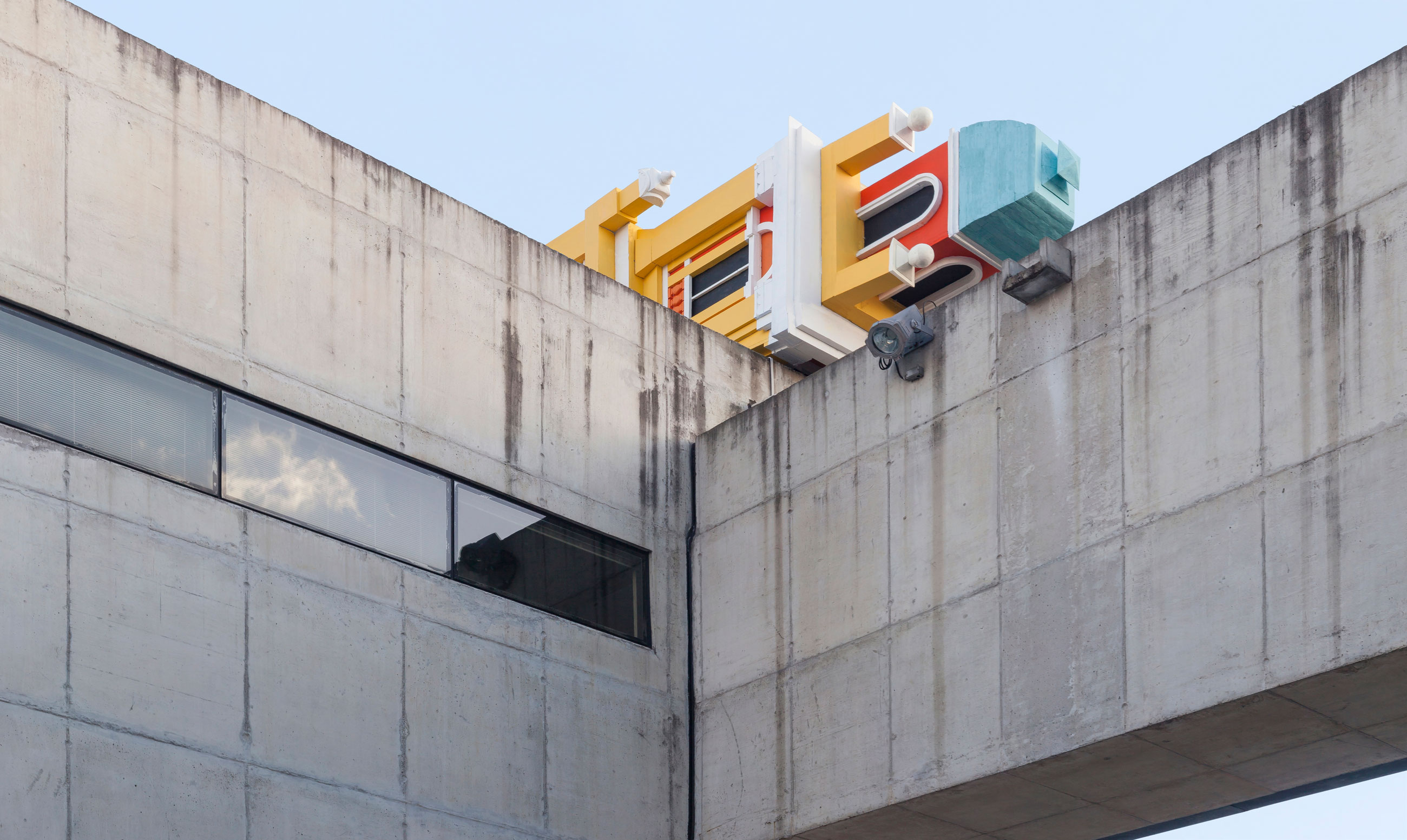 Site-specific Installation titled Friends of Perpetual Movement by artist Quinteros, consisting of a clock tower built with foam, paint, wooden structure, curated by Bruno Alves de Almeida for the project SITU at Galeria Leme, São Paulo, Brazil.