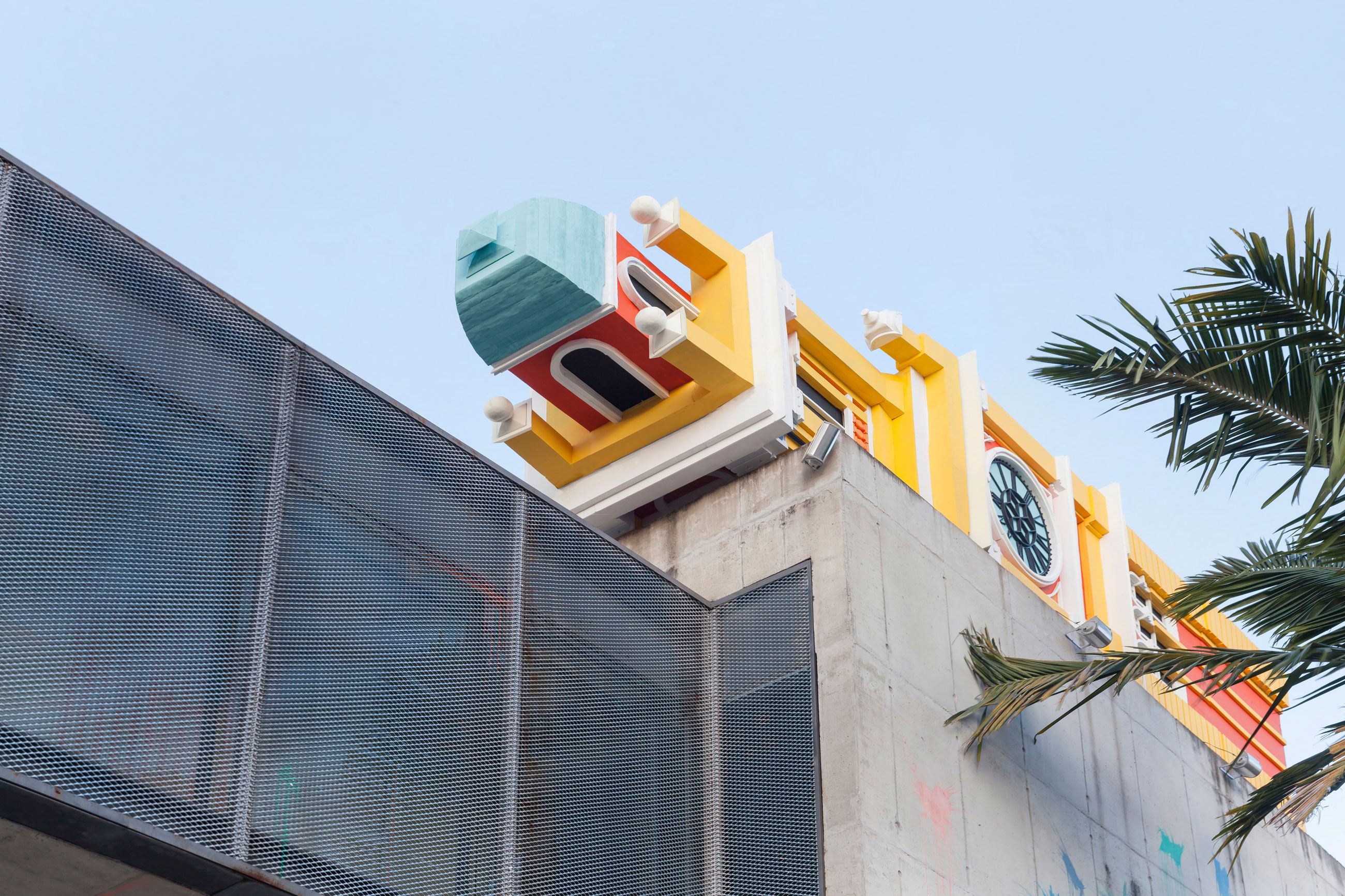 Site-specific Installation titled Friends of Perpetual Movement by artist Quinteros, consisting of a clock tower built with foam, paint, wooden structure, curated by Bruno Alves de Almeida for the project SITU at Galeria Leme, São Paulo, Brazil.
