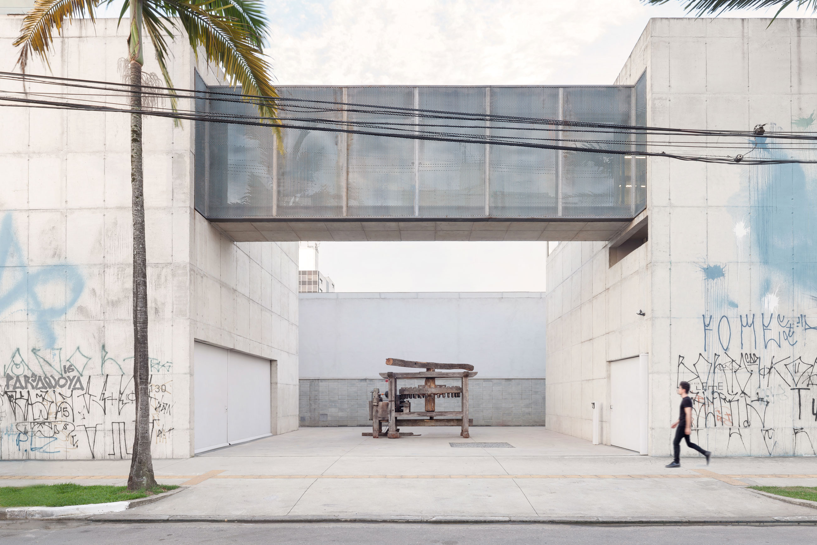 Site-specific Installation titled Phantom Matrix by artist Beto Shwafaty consisting of Sugarcane mill, electric motor, loudspeaker and audio, curated by Bruno Alves de Almeida for the project SITU at Galeria Leme, São Paulo, Brazil.